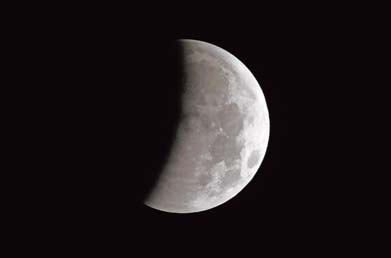 A lunar eclipse turns the moon pink