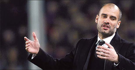 Guardiola extends Barca contract until 2012