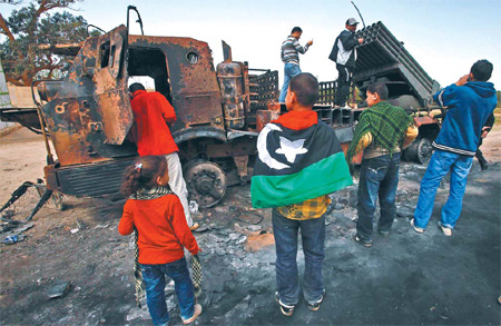 Defiant Gadhafi vows to fight on