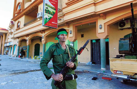 Gadhafi urges West to end attack