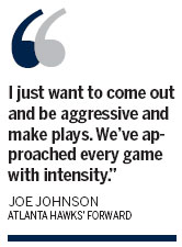 Johnson scores 34 as Hawks upset Bulls 103-95