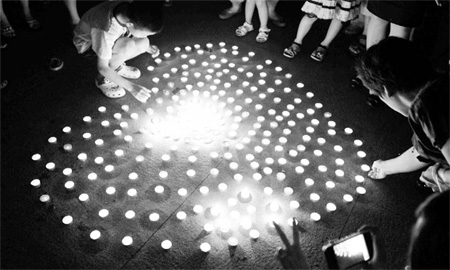 Vigil for child injured in 10-story drop