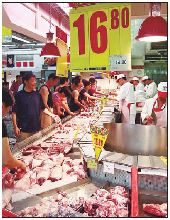 Wen pushes to contain pork prices