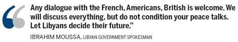 US urges Gadhafi to debt down