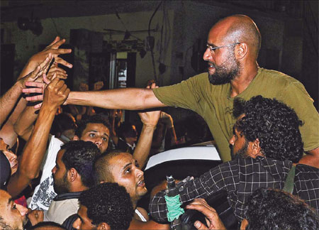 Gadhafi compound stormed
