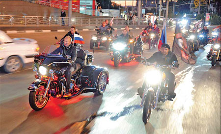 Russia's Putin burns rubber with bikers