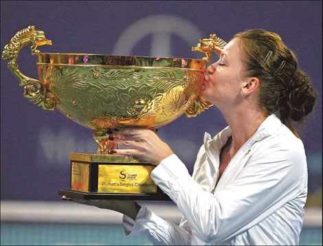 Radwanska survives to claim women's title