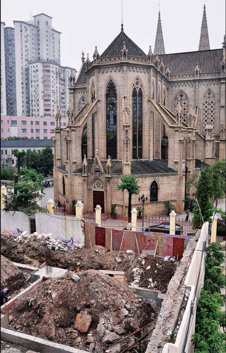 Building halted next to church