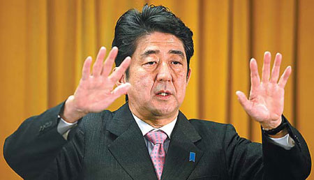 Abe acts tough on islands