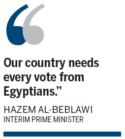 Egyptians vote on new constitution
