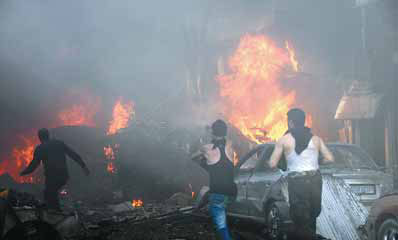 Two car bombs kill 25 in Homs