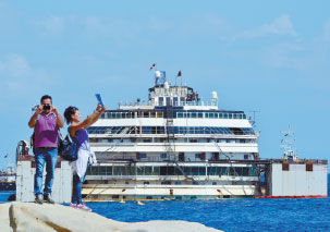 Costa Concordia wreck refloated, awaits towing