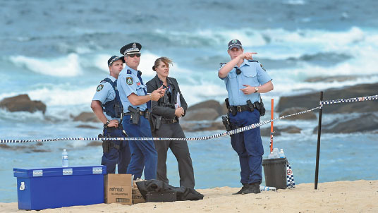Baby's body found buried on beach
