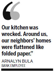 Rescuers struggle to reach villages after typhoon 'folds homes like paper'