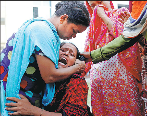 Cracks in building hamper search after packaging factory fire kills 26