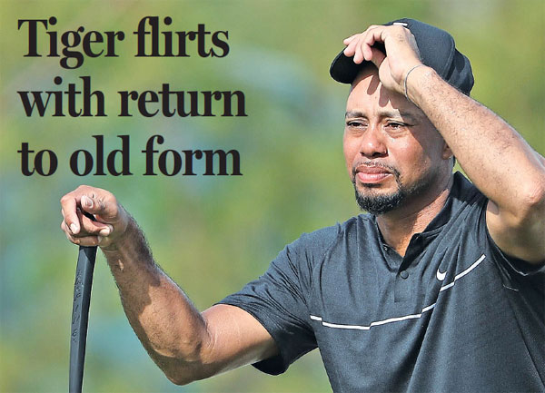 Tiger flirts with return to old form