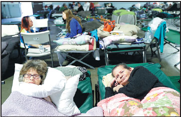 Tens of thousands remain in shelters