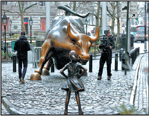 Fearless Girl stares iconic Charging Bull