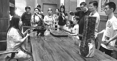 Heritage show in Beijing celebrates continuity of culture
