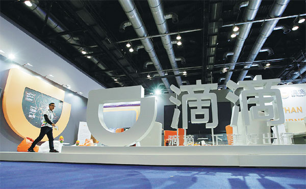 As China's Didi looks abroad, challenges spring up at home
