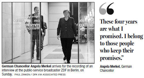 Merkel defends coalition deal against party criticism