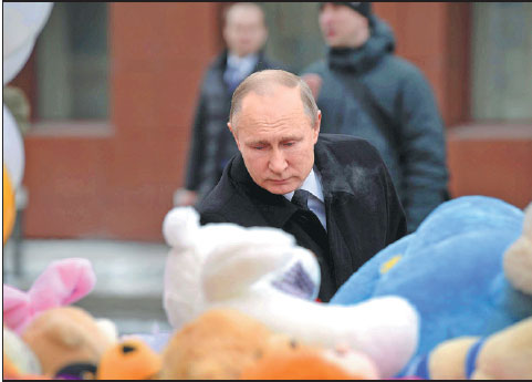 Putin: Blaze caused by 'negligence'