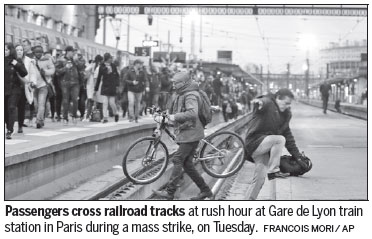 French rail workers take on Macron with mass strikes