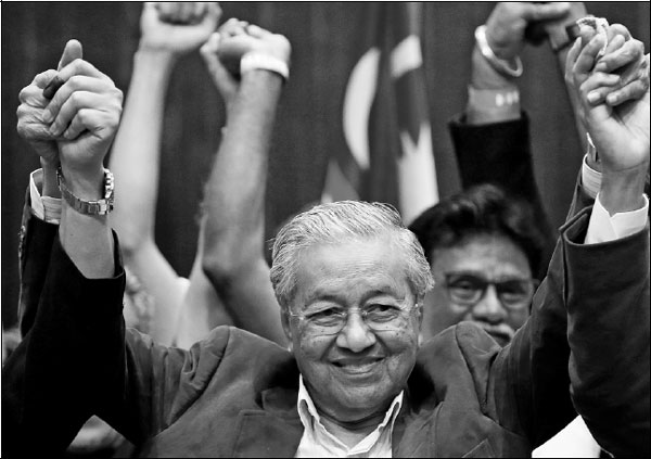 Mahathir sworn in after shock victory