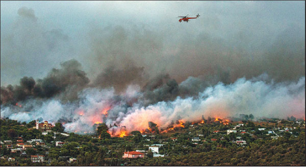 Wildfire kills at least 60 near Athens, families embrace as flames close in