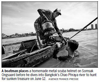 Divers scour river for treasure