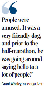 Dog wins medal and hearts of human runners