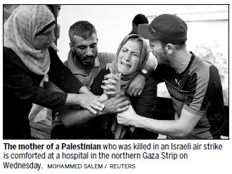 Gaza rocket hits home in Israel, military strikes back