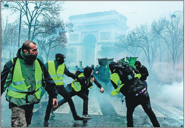 Hundreds of arrests in Paris as protest erupts into violence