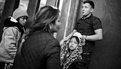 Frustrated migrants from caravan breach US border