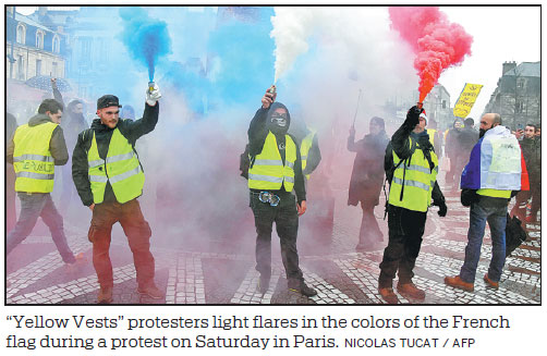 Macron calls for order after 'yellow vests' attack on police