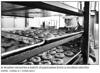 Pancake-making skills handed down under watchful eye of inheritor