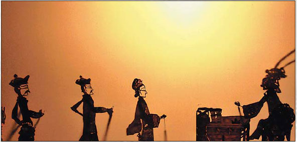 Traditional shadow puppeteers carry tradition forward