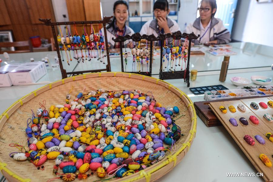 Art teacher creates unique paintings on silkworm cocoons