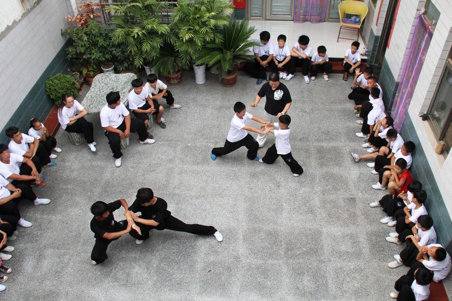 Students learn tai chi in Henan