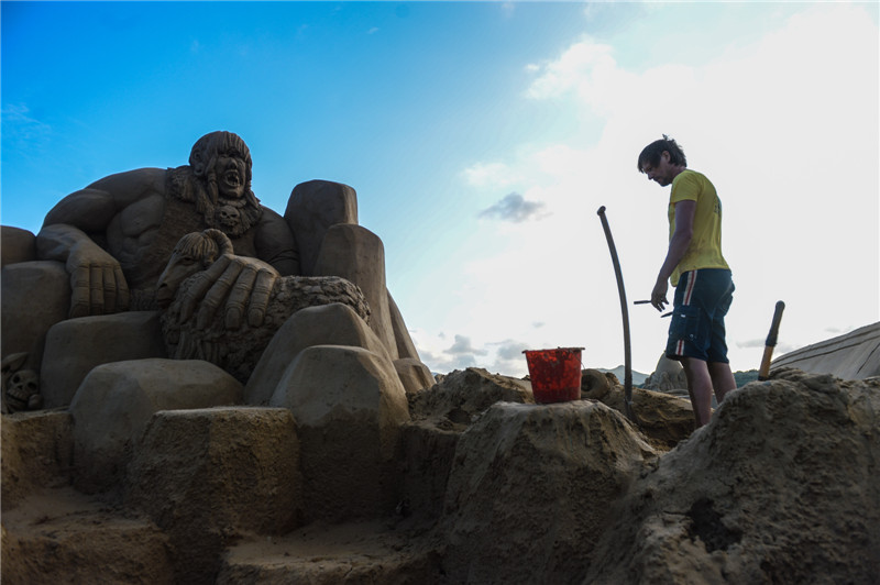 Sand sculptures take shape in East China