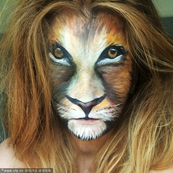 Make-up artist creates special-effects on her face