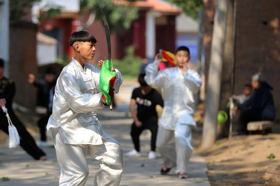 People practice tai chi in Henan