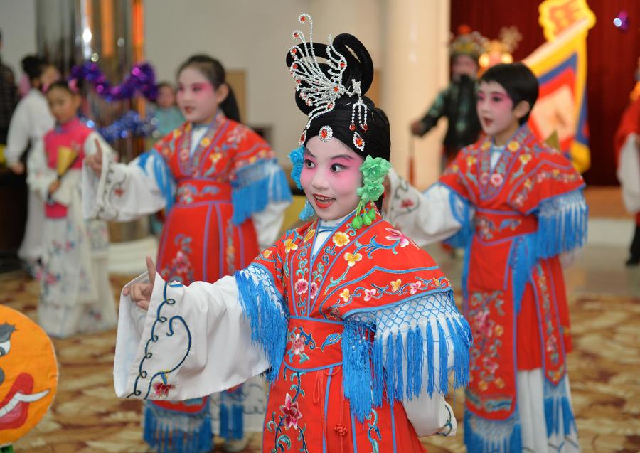 Children perform traditional Chinese Peking Opera