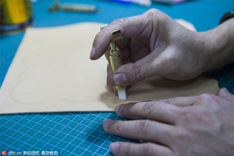 A leather engraver's meditative craft