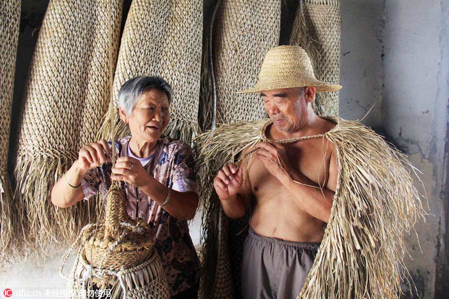 Woman keeps art of making straw rain cape alive