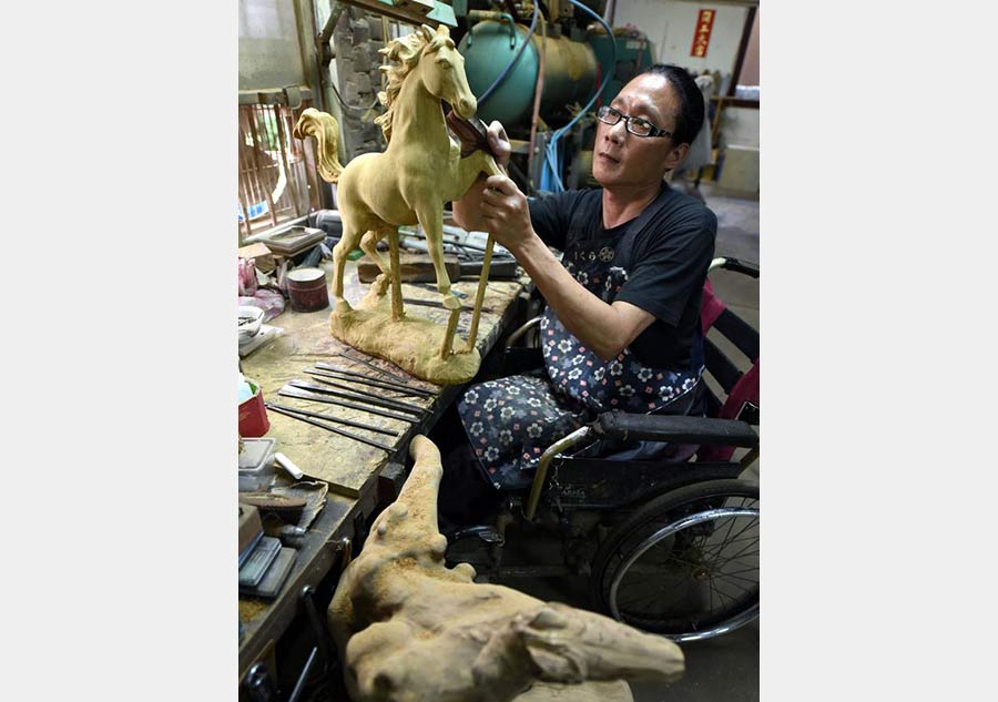 Artworks on wheelchair: Lin Cheng-Fa and his sculptures