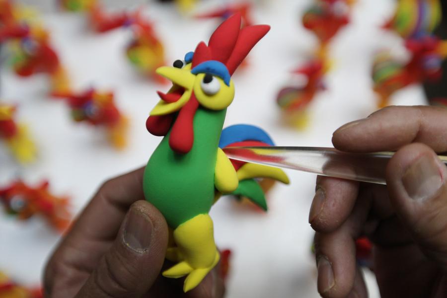 Rooster-shaped dough modellings made to greet Chinese lunar new year