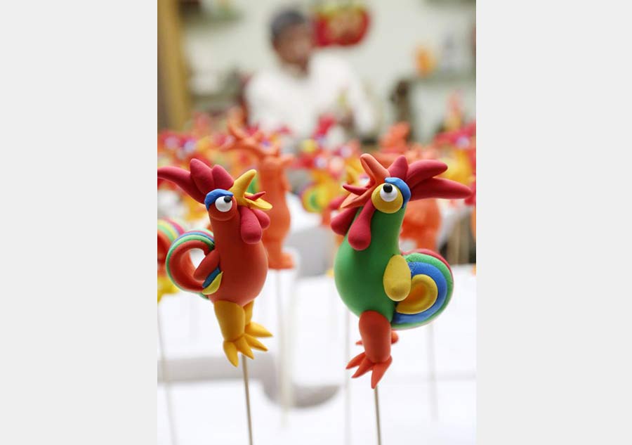 Rooster-shaped dough modellings made to greet Chinese lunar new year