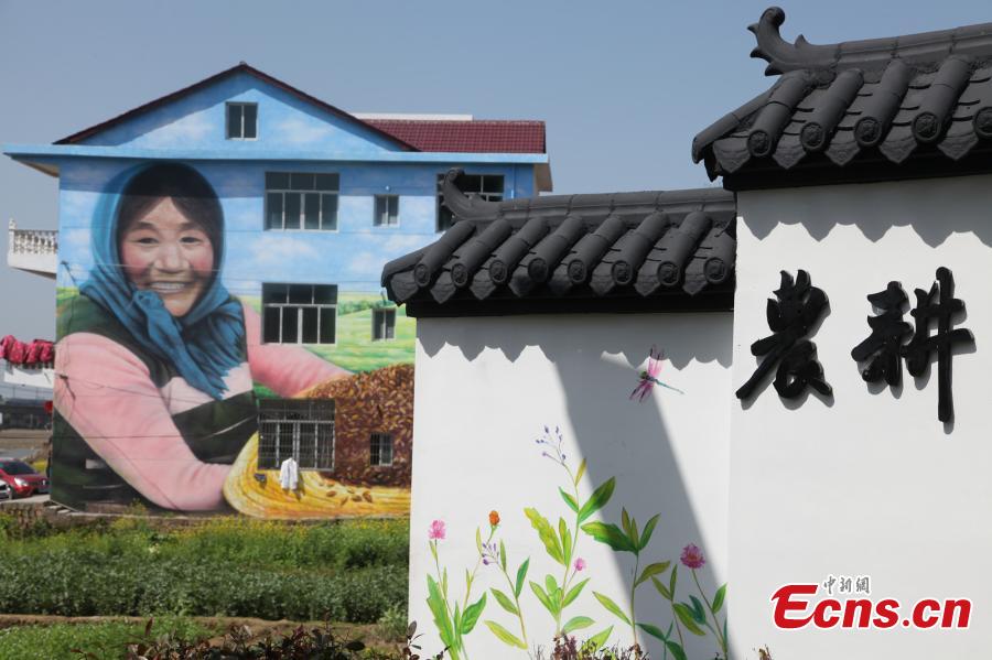 Giant 3D paintings draw visitors to remote village