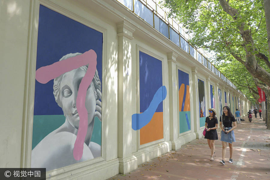 Murals turn construction site into art corridor
